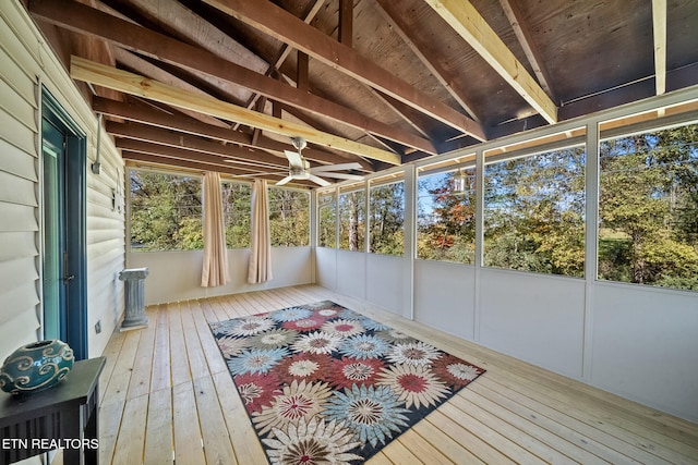 unfurnished sunroom with a ceiling fan