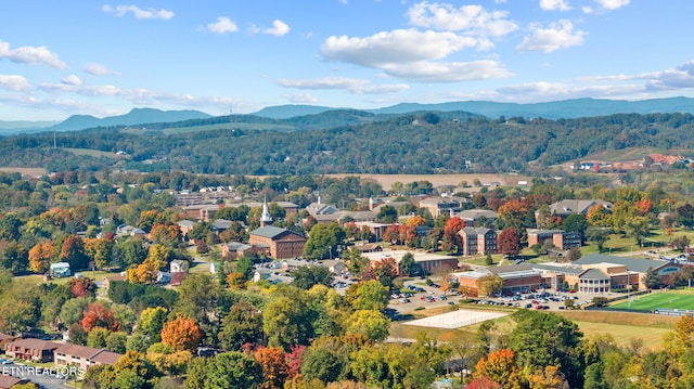 drone / aerial view featuring a residential view and a mountain view