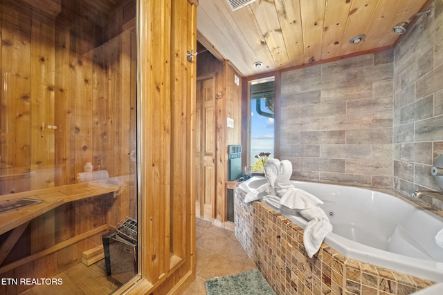 bathroom featuring tiled bath, tile patterned floors, and wood ceiling