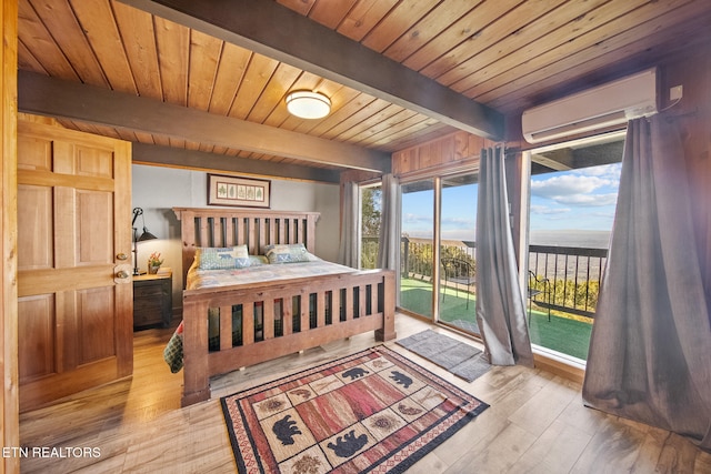 bedroom with a wall mounted air conditioner, light hardwood / wood-style flooring, wood ceiling, and access to exterior