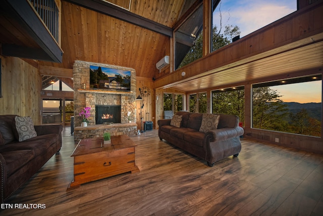 living room with a stone fireplace, wood walls, high vaulted ceiling, and dark hardwood / wood-style flooring