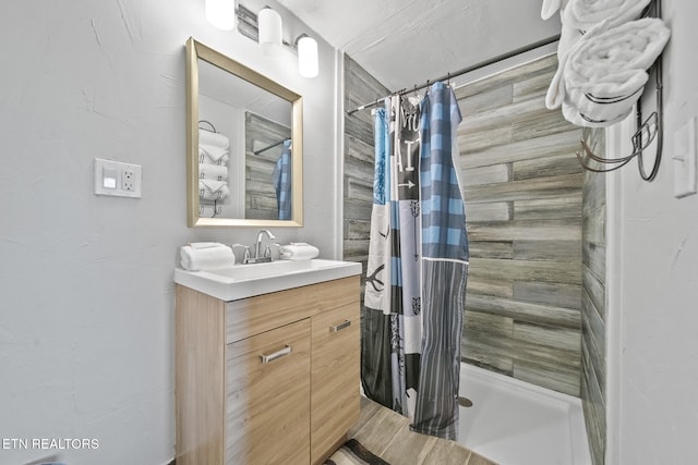 bathroom with vanity and a shower with curtain