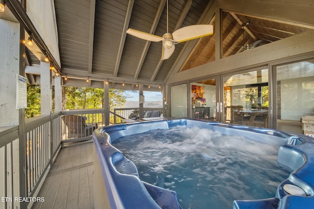 wooden terrace featuring a hot tub and ceiling fan