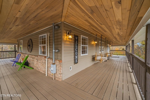 wooden deck featuring covered porch