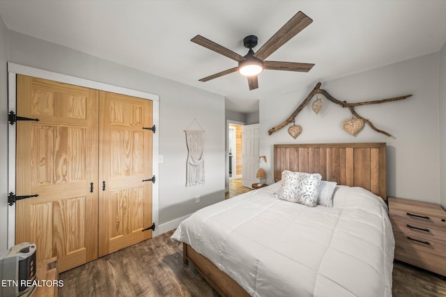 bedroom with ceiling fan and dark hardwood / wood-style flooring