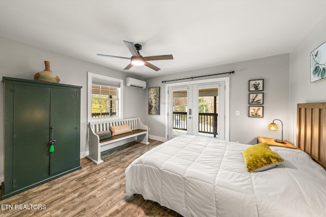 bedroom featuring multiple windows, hardwood / wood-style flooring, an AC wall unit, and ceiling fan