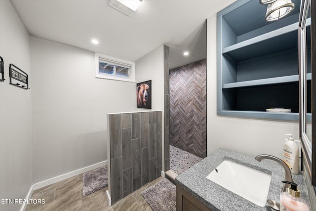 bathroom with vanity and a shower