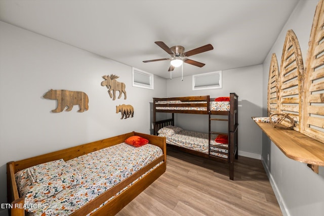 bedroom featuring light hardwood / wood-style flooring and ceiling fan