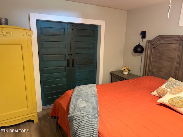 bedroom with hardwood / wood-style flooring