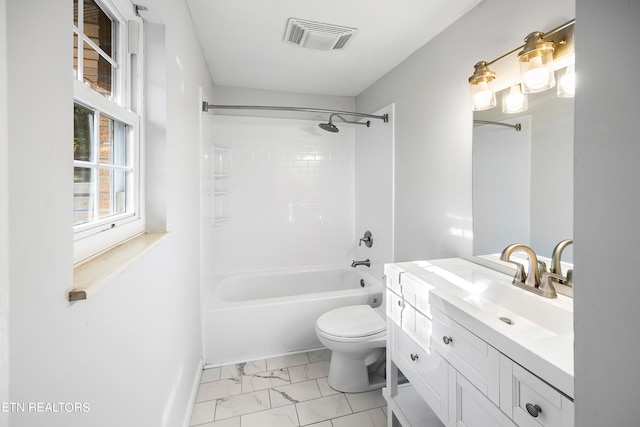 full bathroom featuring vanity, toilet, and tiled shower / bath