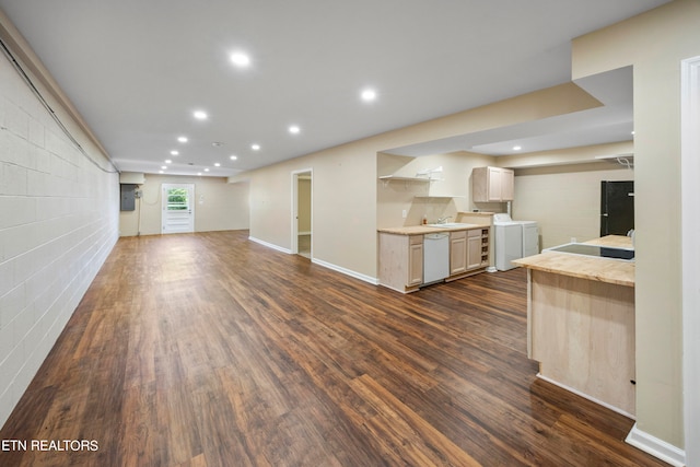 kitchen featuring dark wood finished floors, light countertops, and dishwasher