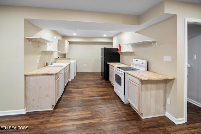 kitchen with a sink, white appliances, open shelves, and dark wood-style flooring