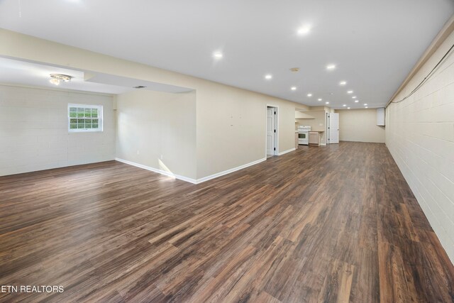 unfurnished living room with dark hardwood / wood-style flooring