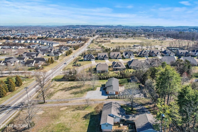 birds eye view of property with a residential view