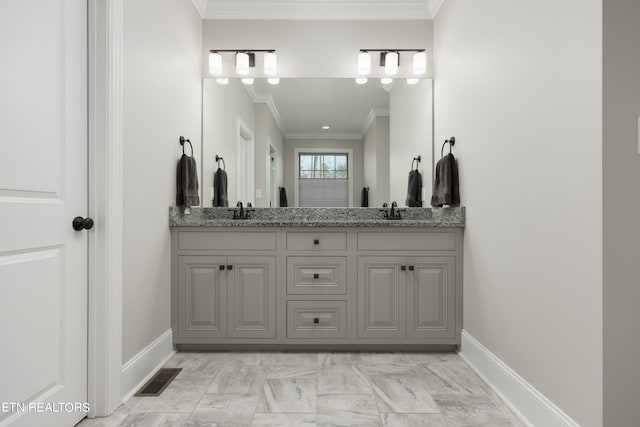 bathroom featuring vanity and crown molding