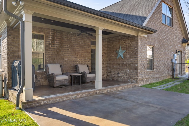 view of patio / terrace with area for grilling and ceiling fan