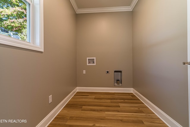 laundry room with hookup for a washing machine, wood finished floors, electric dryer hookup, laundry area, and ornamental molding