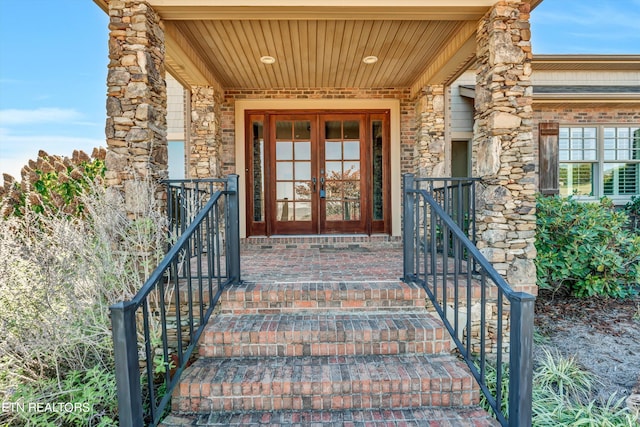 view of exterior entry featuring french doors