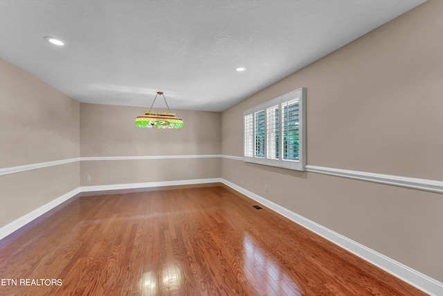 unfurnished dining area featuring hardwood / wood-style flooring