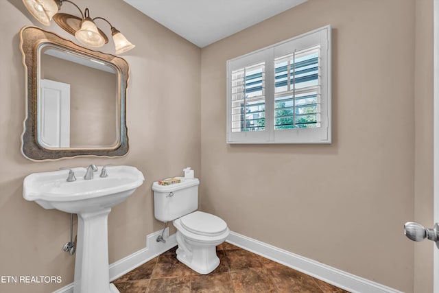 bathroom with sink and toilet