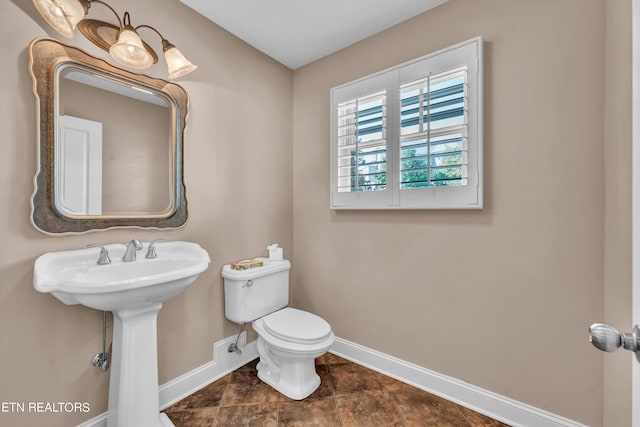 3909 Logans Landing Cir, Louisville, TN 37777 - half bath with baseboards, toilet, and a sink