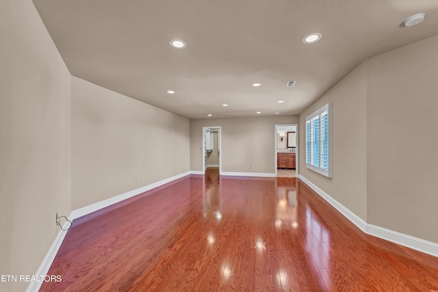 spare room featuring hardwood / wood-style flooring