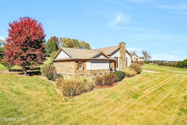 3909 Logans Landing Cir, Louisville, TN 37777 - view of side of property featuring a yard, stone siding, and a chimney