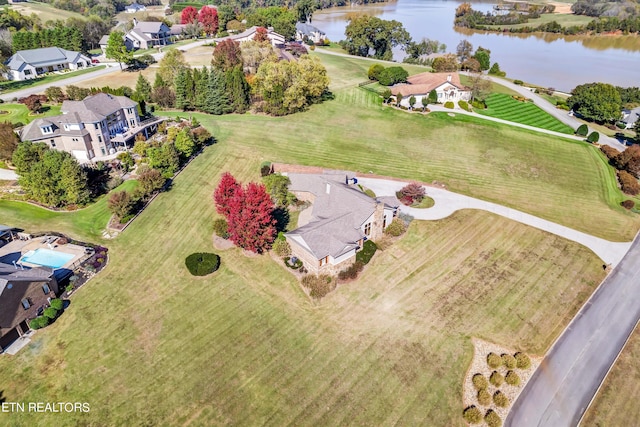 birds eye view of property with a water view