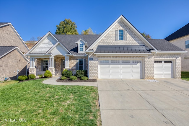 craftsman-style home featuring a front yard and a garage