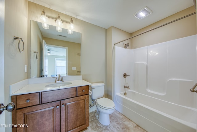 full bathroom featuring shower / bathing tub combination, toilet, ceiling fan, vanity, and tile patterned flooring