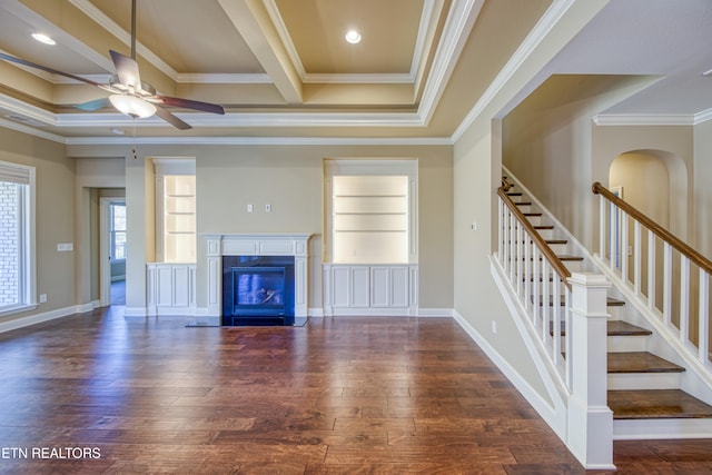 unfurnished living room with crown molding, ceiling fan, and dark hardwood / wood-style flooring