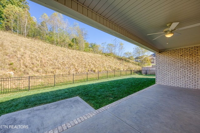 view of yard with a patio and ceiling fan