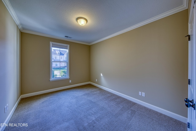 unfurnished room featuring ornamental molding, a textured ceiling, and carpet flooring