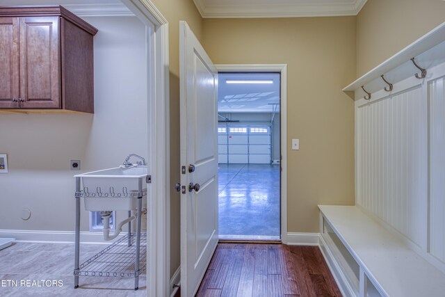 mudroom featuring crown molding and hardwood / wood-style floors