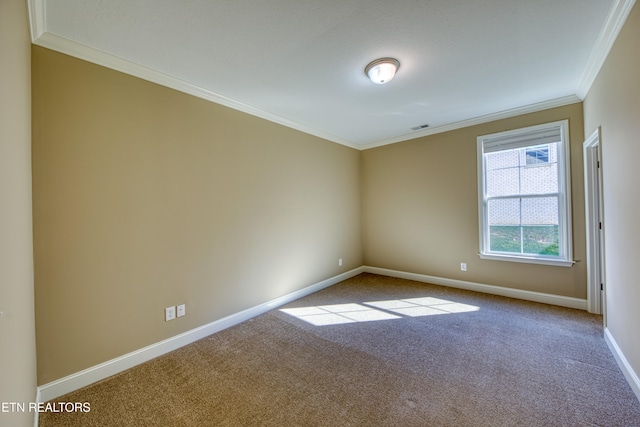 unfurnished room featuring crown molding and carpet