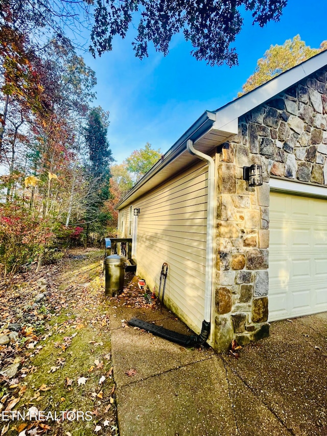 view of side of property featuring a garage