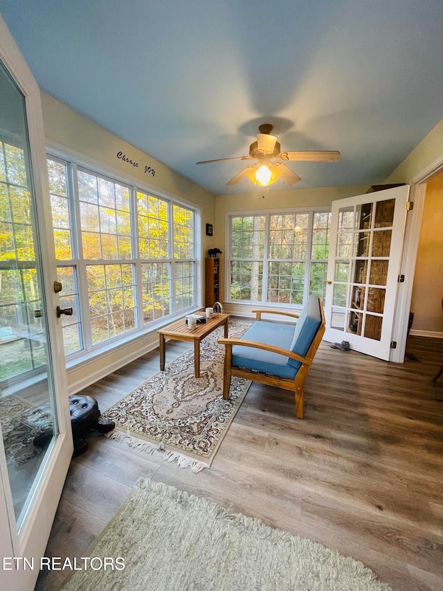 sunroom / solarium with ceiling fan and plenty of natural light