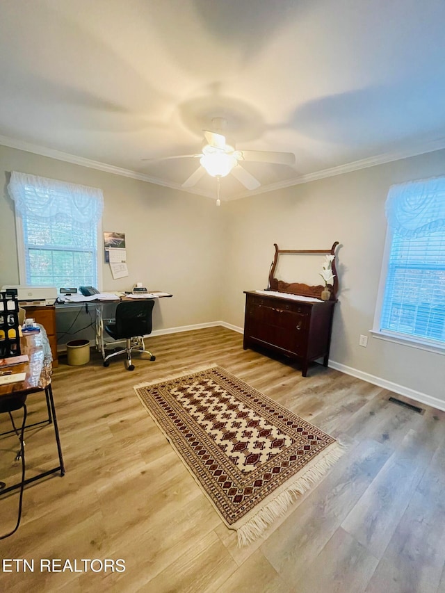 office space featuring ceiling fan, ornamental molding, and hardwood / wood-style floors