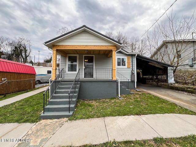 bungalow-style house with a carport and covered porch