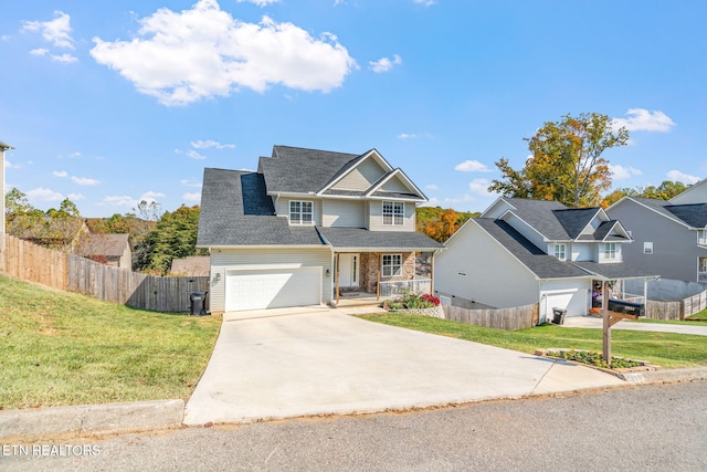 view of front of house with a front yard and a garage