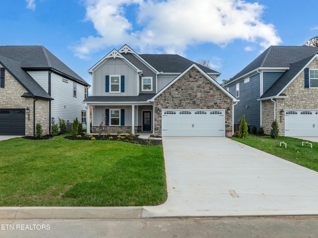 view of front of property featuring a garage, covered porch, and a front yard