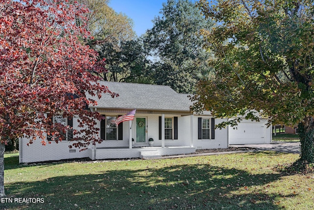 view of front facade with a front lawn and a garage