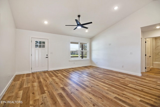 interior space with light hardwood / wood-style flooring, ceiling fan, and vaulted ceiling