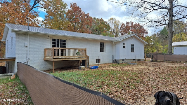 back of house featuring a deck