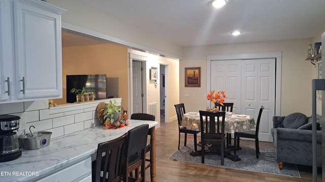 dining space featuring dark hardwood / wood-style flooring