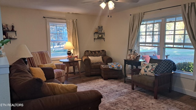 sitting room featuring ceiling fan and hardwood / wood-style floors