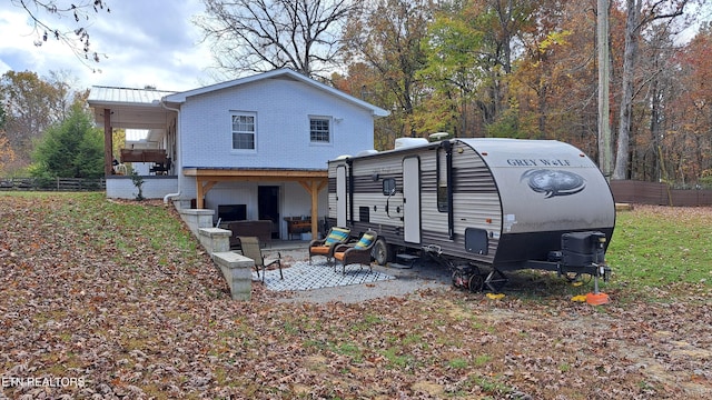 rear view of property with a patio area