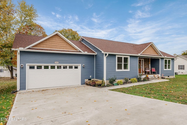 view of front facade featuring a garage and a front yard