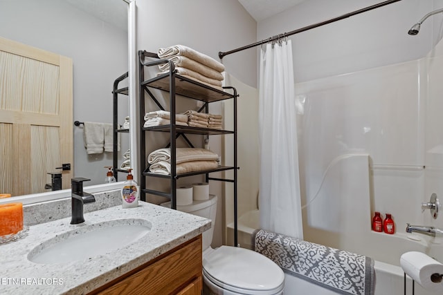 full bathroom featuring toilet, vanity, and shower / tub combo