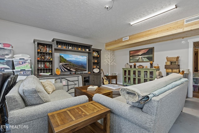 living room with a textured ceiling